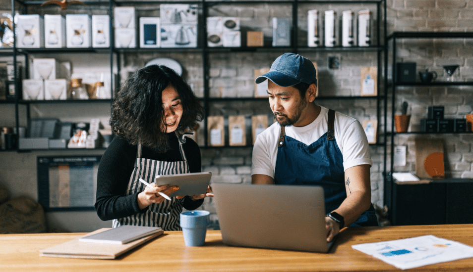 The owners of this coffee shop engage in a lively discussion, exchanging ideas and making plans for the business.