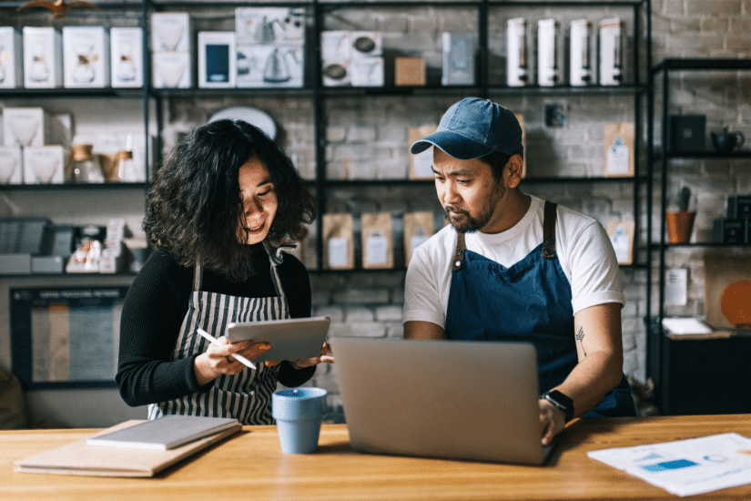 The owners of this coffee shop engage in a lively discussion, exchanging ideas and making plans for the business.