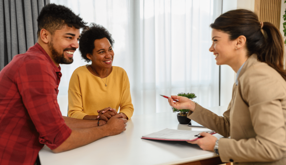 The black couple in a meeting with their financial advisor.