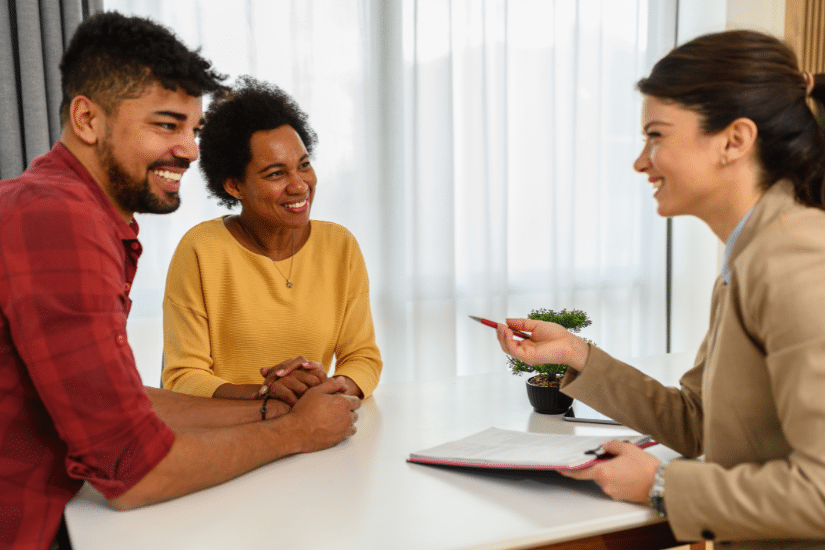 The black couple in a meeting with their financial advisor.