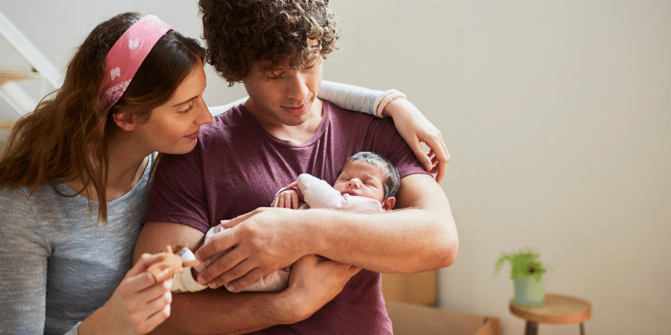 Parents holding their new born baby.