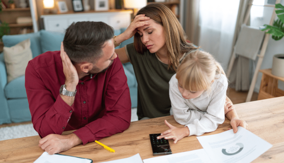 Young family with a daughter feeling stressed managing budget and paying bills and taxes