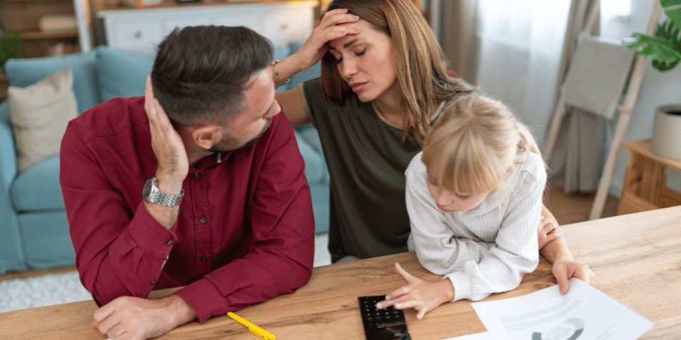 Young family with a daughter feeling stressed managing budget and paying bills and taxes