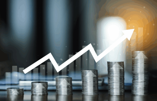 Stack of coins on a table. money earning profit business concept.