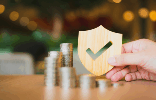 Shield protect icon with coins stack, Security protection and life insurance.