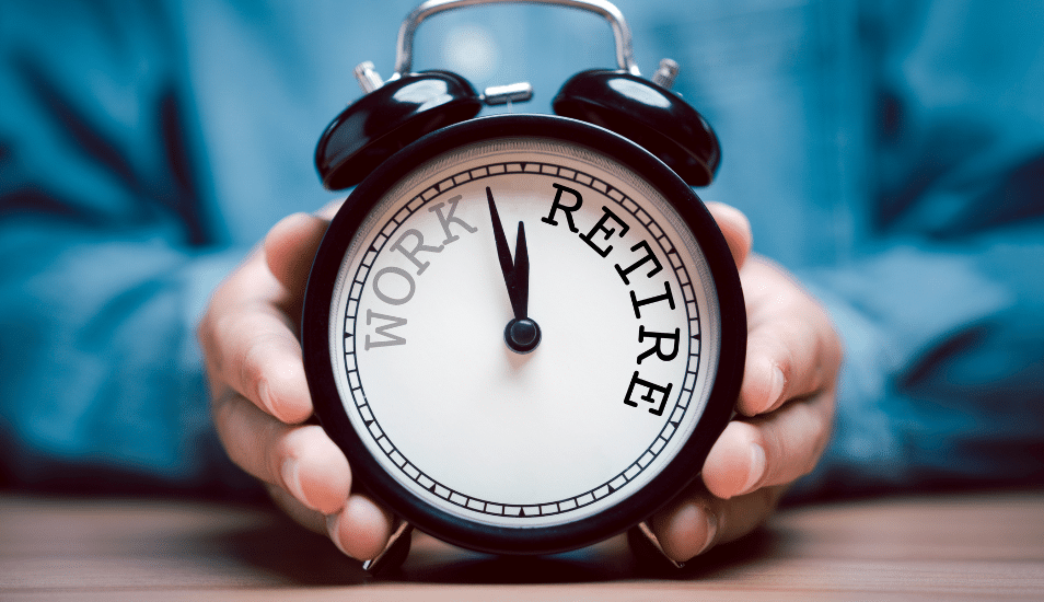 Businessman holding black alarm clock with clockwise countdown from work to retirement.