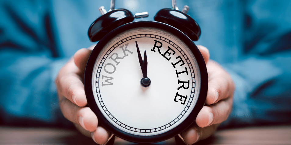 Businessman holding black alarm clock with clockwise countdown from work to retirement.